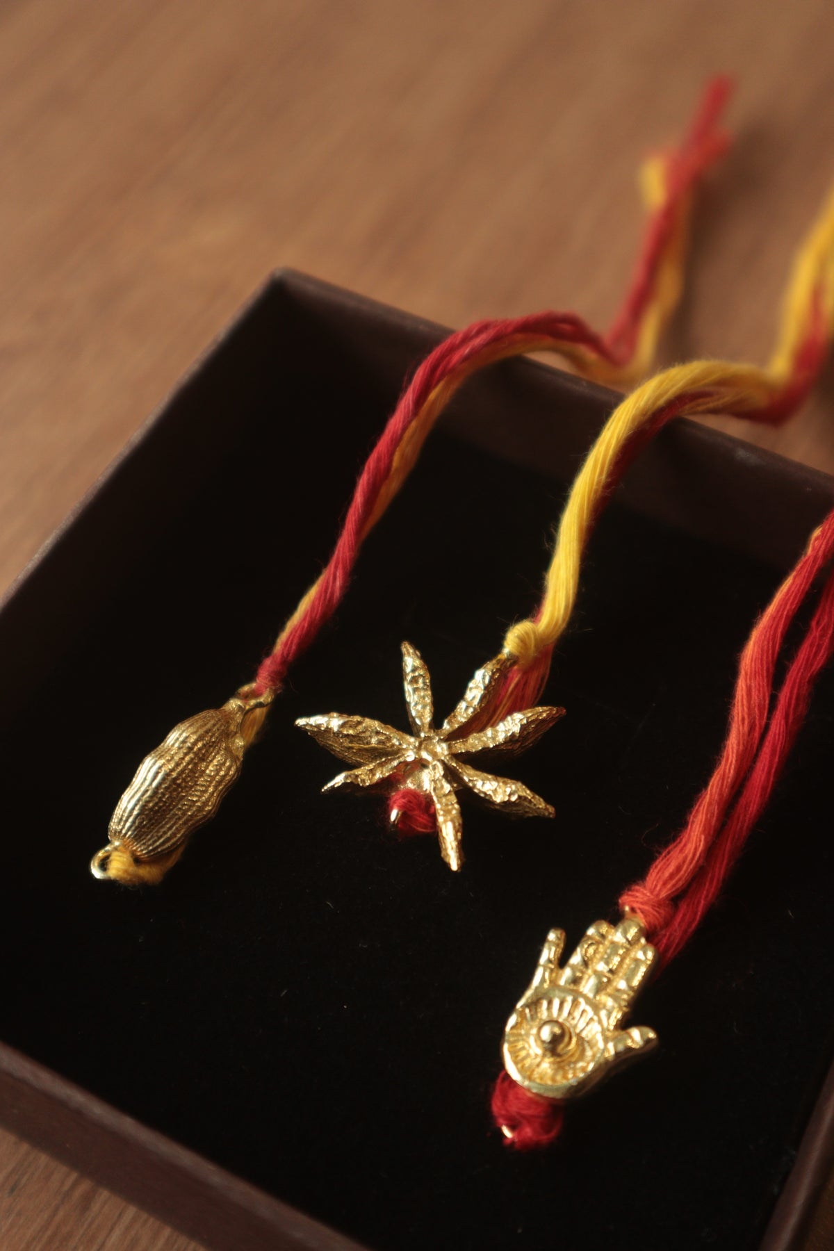 Rakhis- Cardamom, star anise, hamsa hand